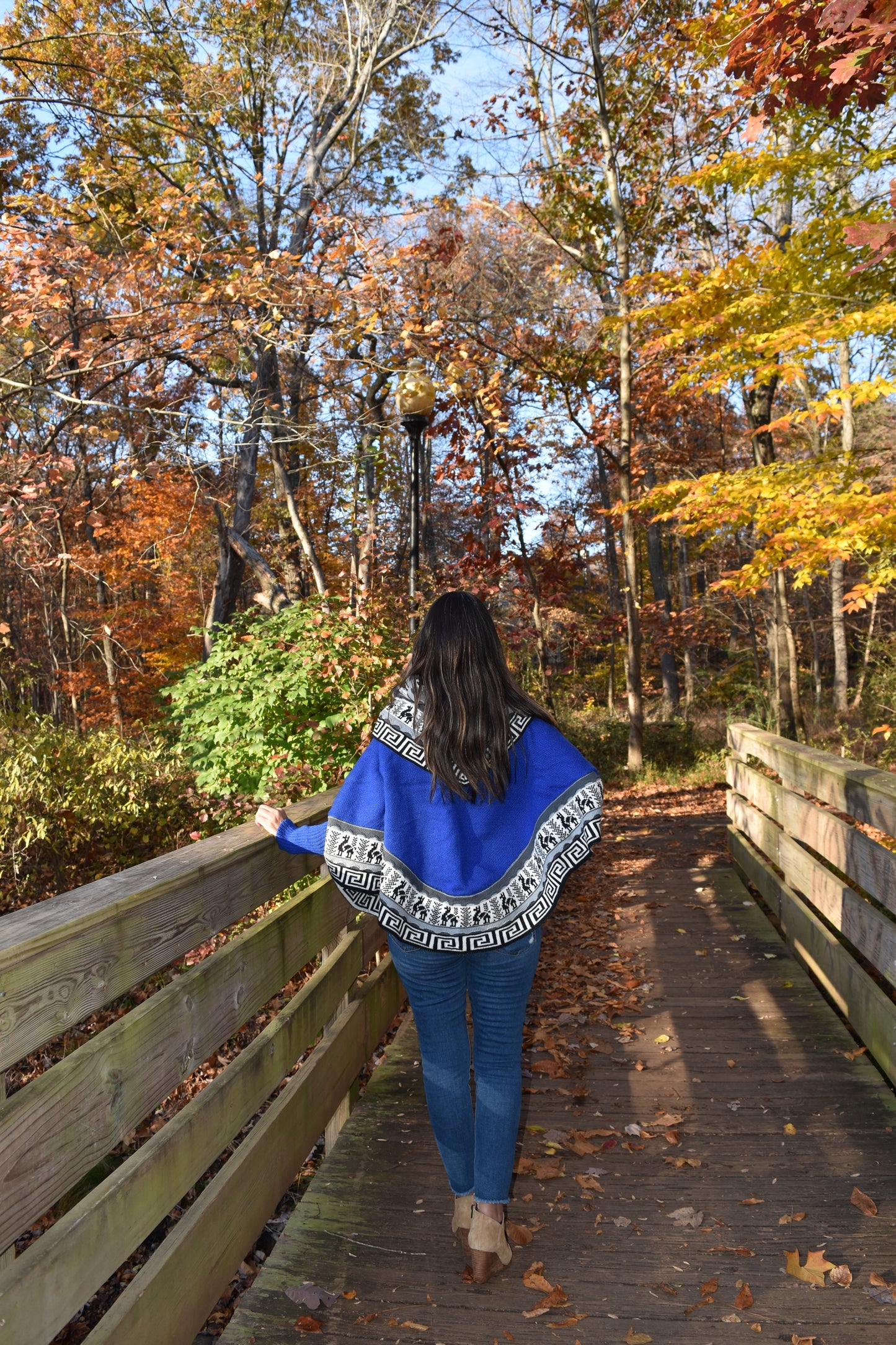 Blue knitted turtleneck poncho, alpaca poncho with long sleeves.