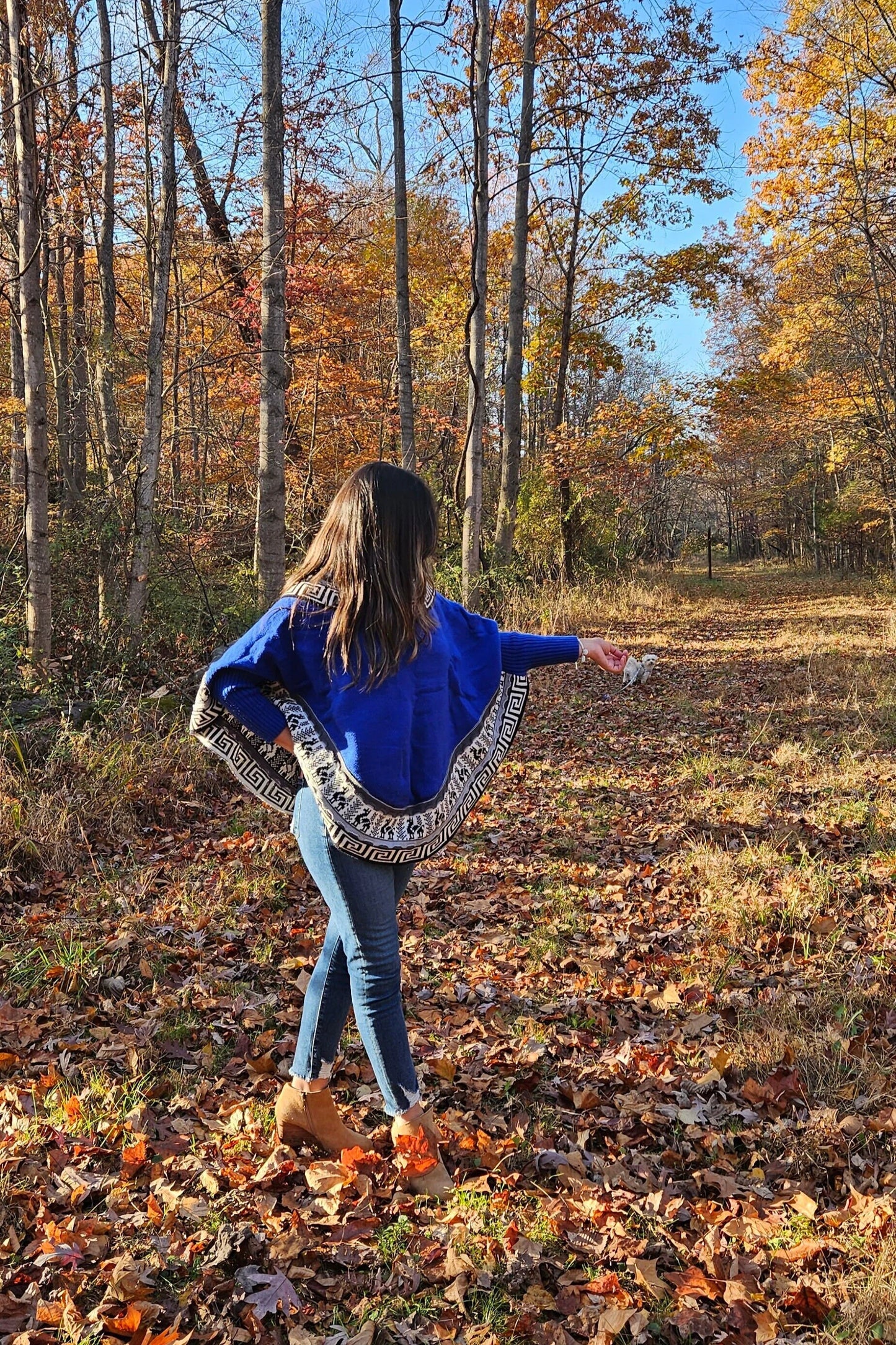 Blue knitted turtleneck poncho, alpaca poncho with long sleeves.