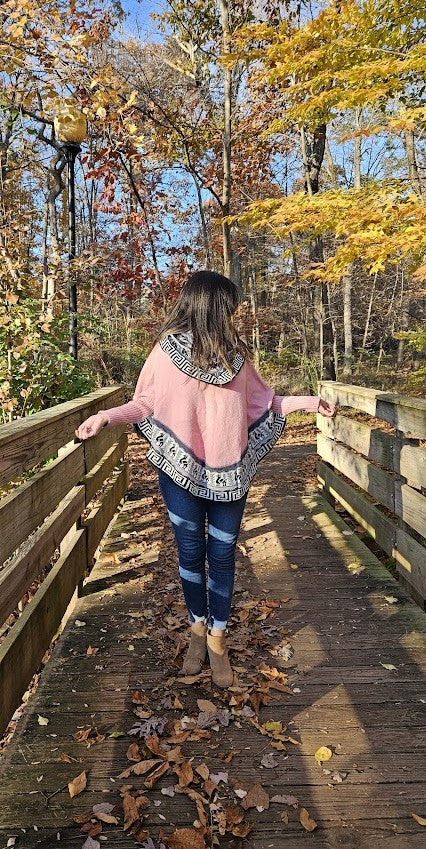 Light pink knitted turtleneck poncho, alpaca poncho with sleeves.